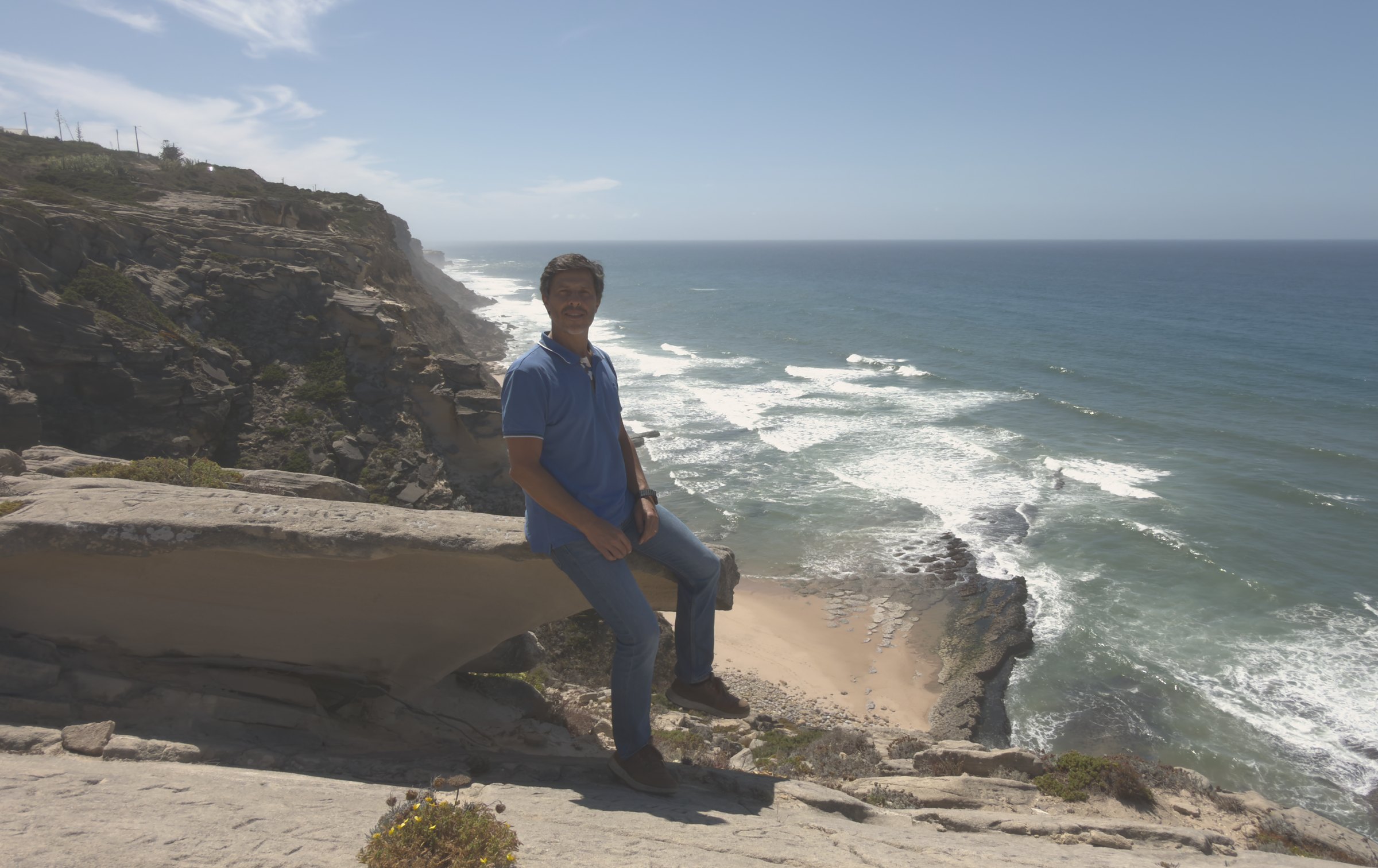 Hélder Cunha seated on the cliffs above the Atlantic, near Cabo da Roca